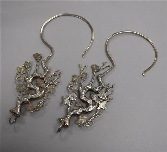 A pair of Chinese silver mosquito net holders